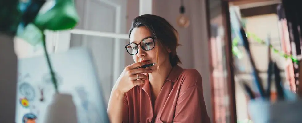 Woman studying a drawing.