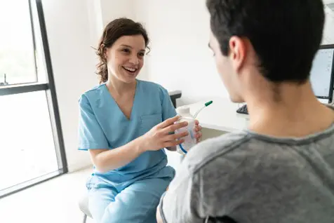 header image of respiratory therapist talking with patient