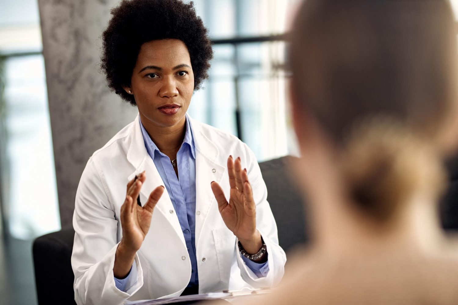 Female therapist counseling her patient during a session.