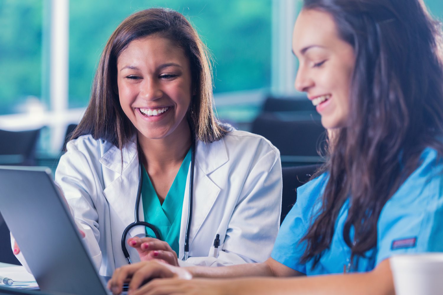 Young Hispanic nursing students studying for medical education exam