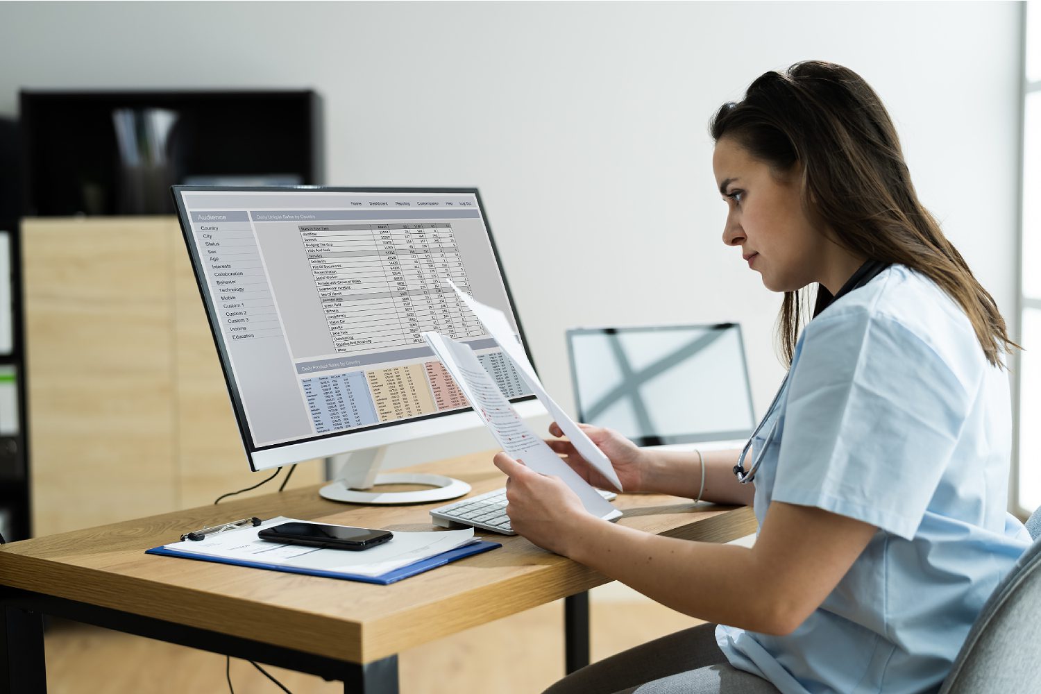 A focused business analyst woman analyzing medical bill codes and spreadsheet data in a professional setting. The image highlights her expertise as she meticulously reviews and interprets complex healthcare financial information. This portrays the intersection of business analytics and healthcare, underlining the crucial role of women in analyzing and managing medical billing data for effective decision-making.