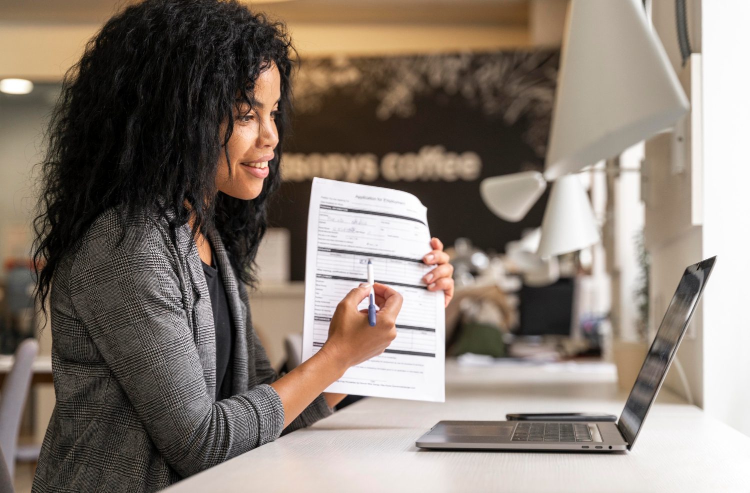 Medium shot of a woman showing a contract.